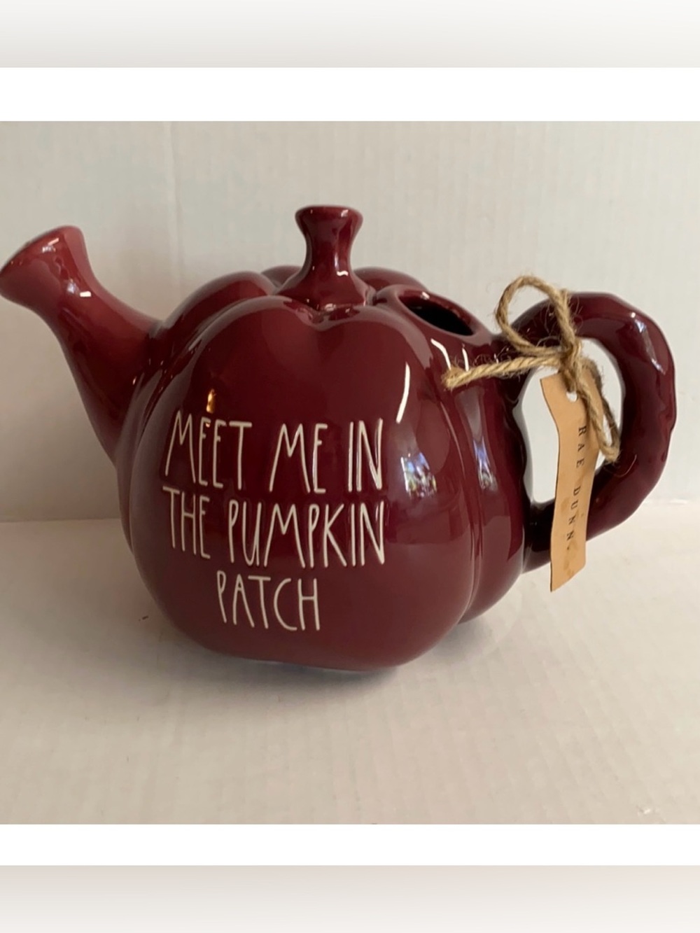 NWT Rae Dunn “ Meet me in the Pumpkin Patch”Brown pottery watering jug with lid.